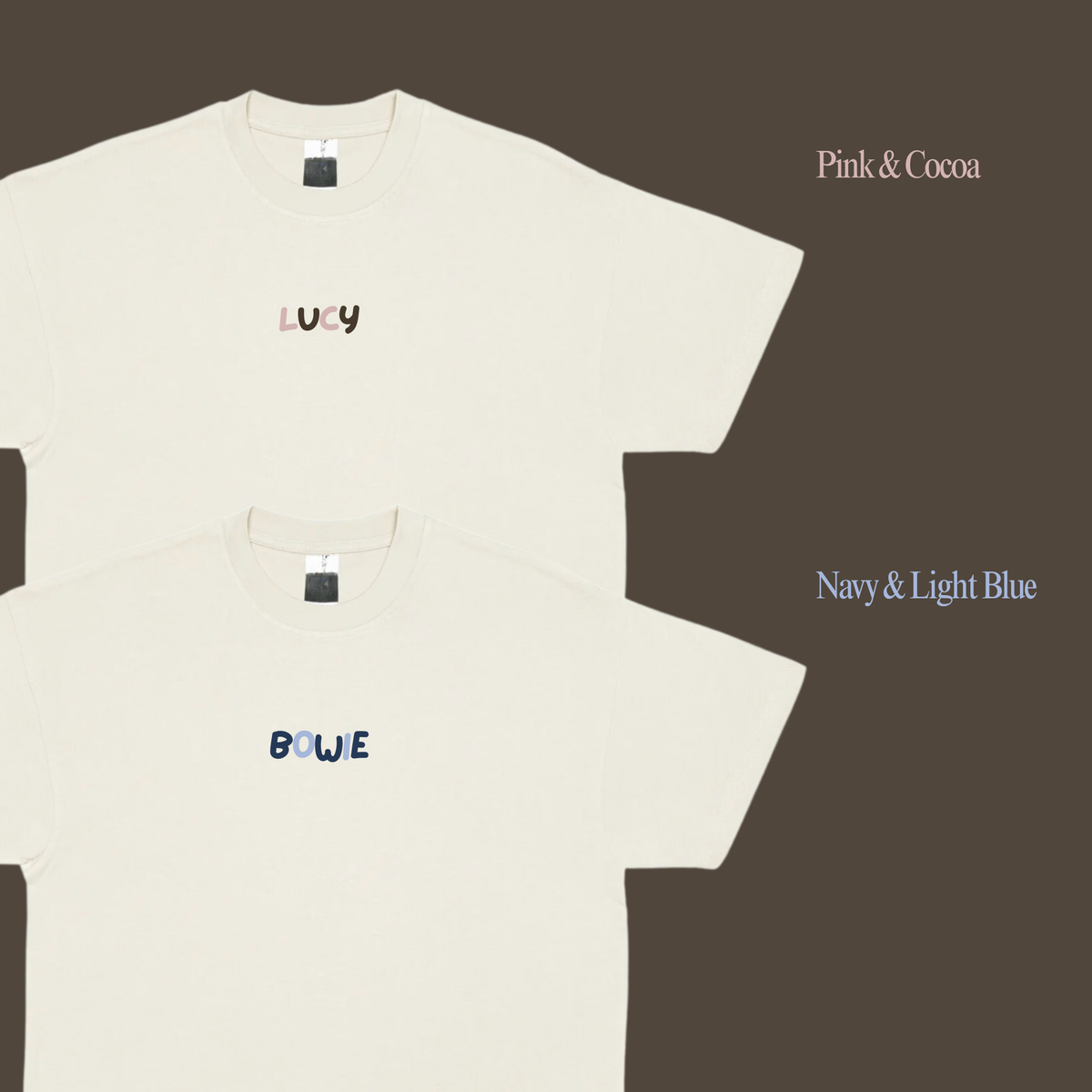 Two cream tee fronts showing Lucy and Blue chest names in Pink & Cocoa and Navy & Light Blue colour options.