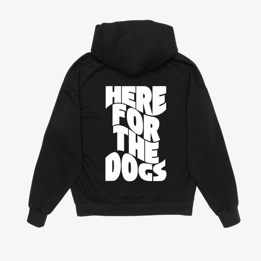 Back of a black hoodie with large white “Here for the Dogs” lettering stacked vertically.