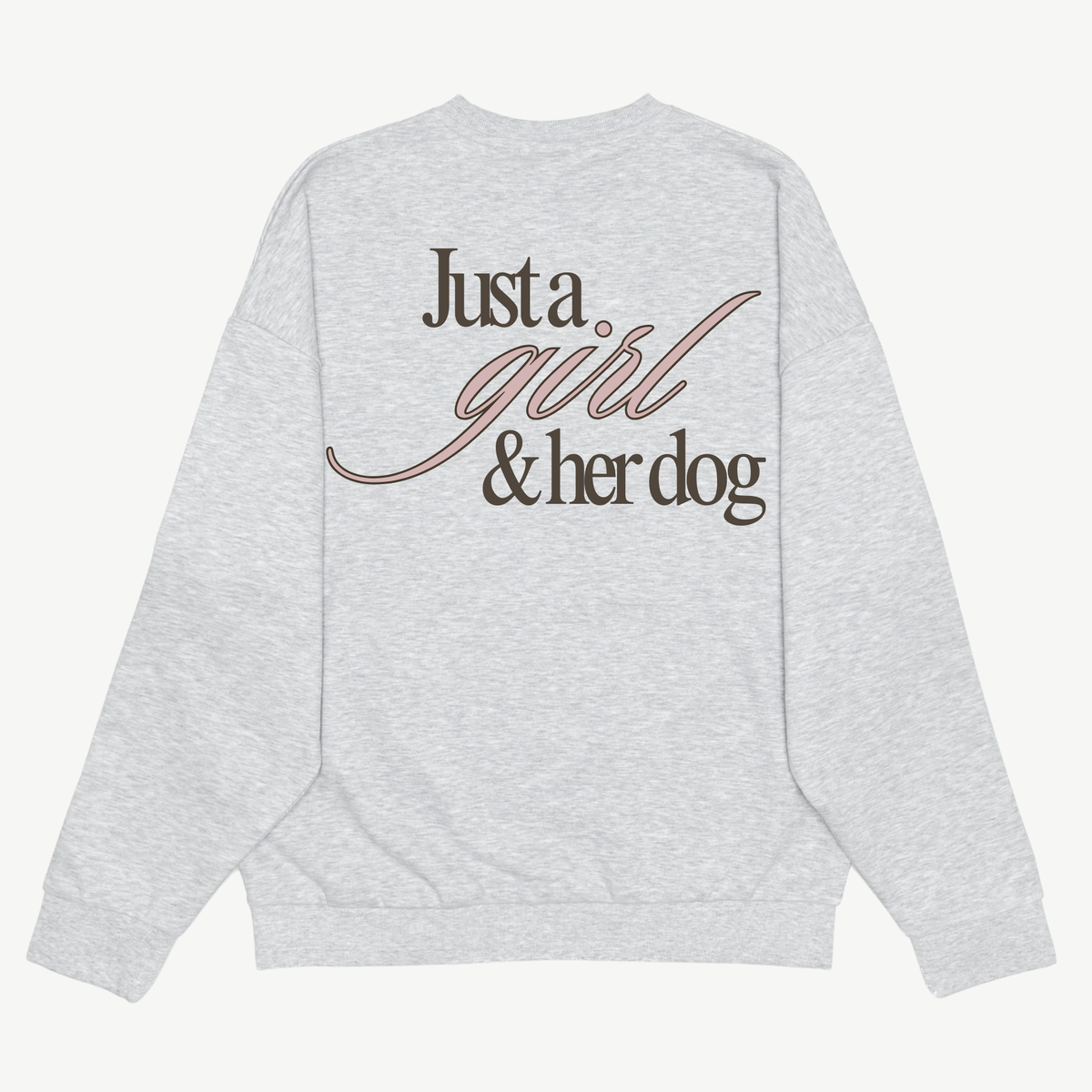 Back of a light grey crewneck with large “Just a girl & her dog” lettering in dark brown and pink.