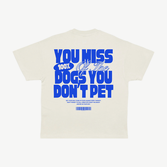 Back of a cream tee with blue “You miss 100% of the dogs you don’t pet” lettering.