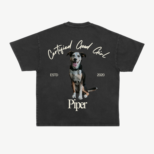 Back of a black tee with Piper’s dog portrait, name, and cream “Certified Good Girl” lettering.