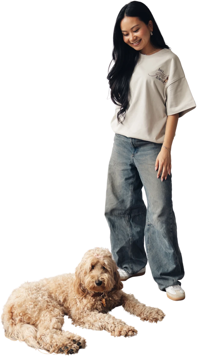 Oversized cream tee worn beside a resting dog